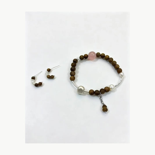 Agarwood rose quartz pearl bracelet and earring set front view