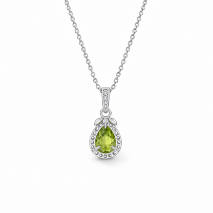 Pear-cut peridot halo necklace in sterling silver, open-back setting view on white