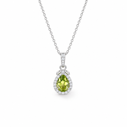 Pear-cut peridot halo necklace in sterling silver, front view on white