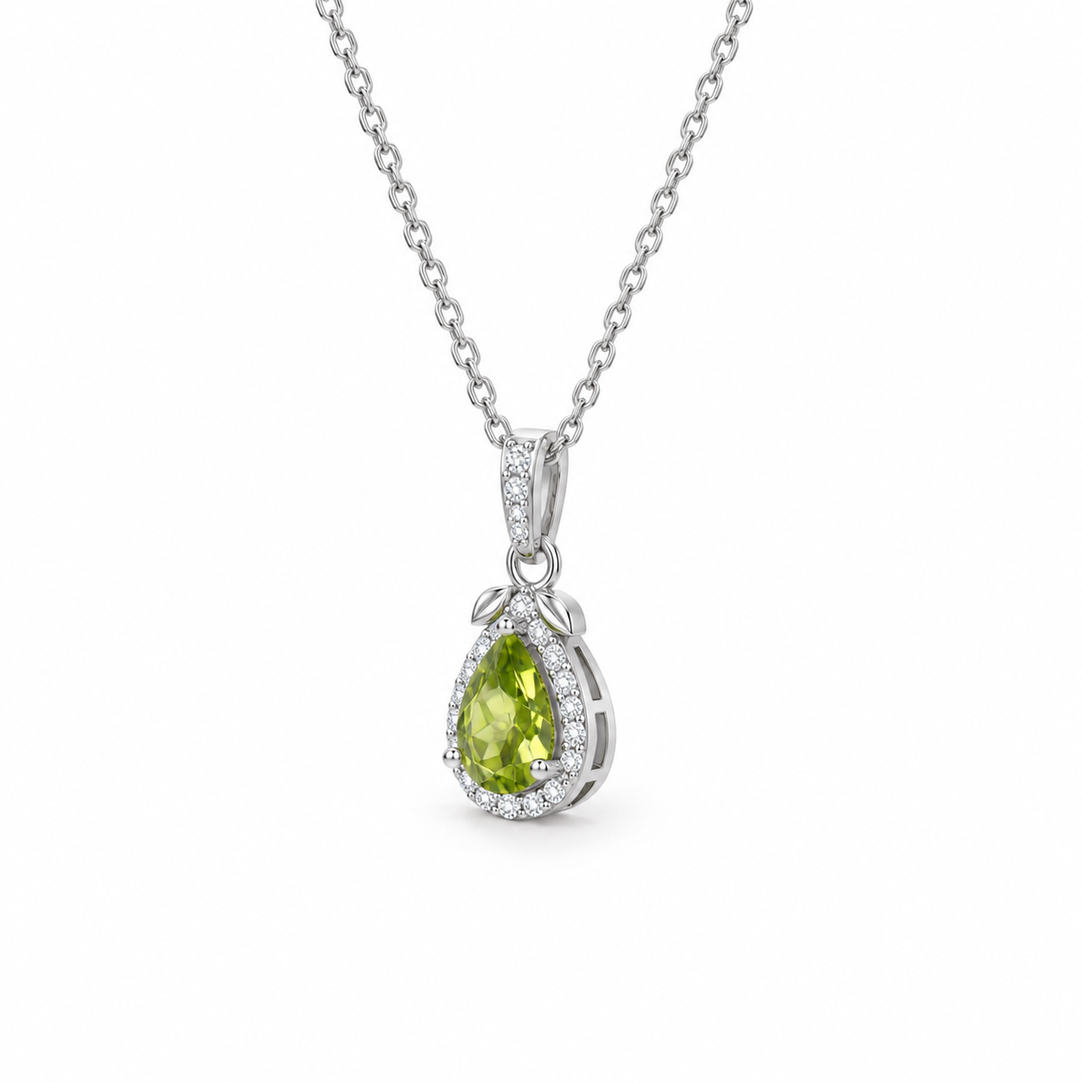 Pear-cut peridot halo necklace in sterling silver, 45-degree side view on white