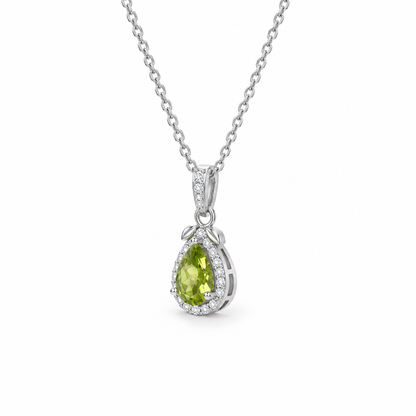 Pear-cut peridot halo necklace in sterling silver, 45-degree side view on white