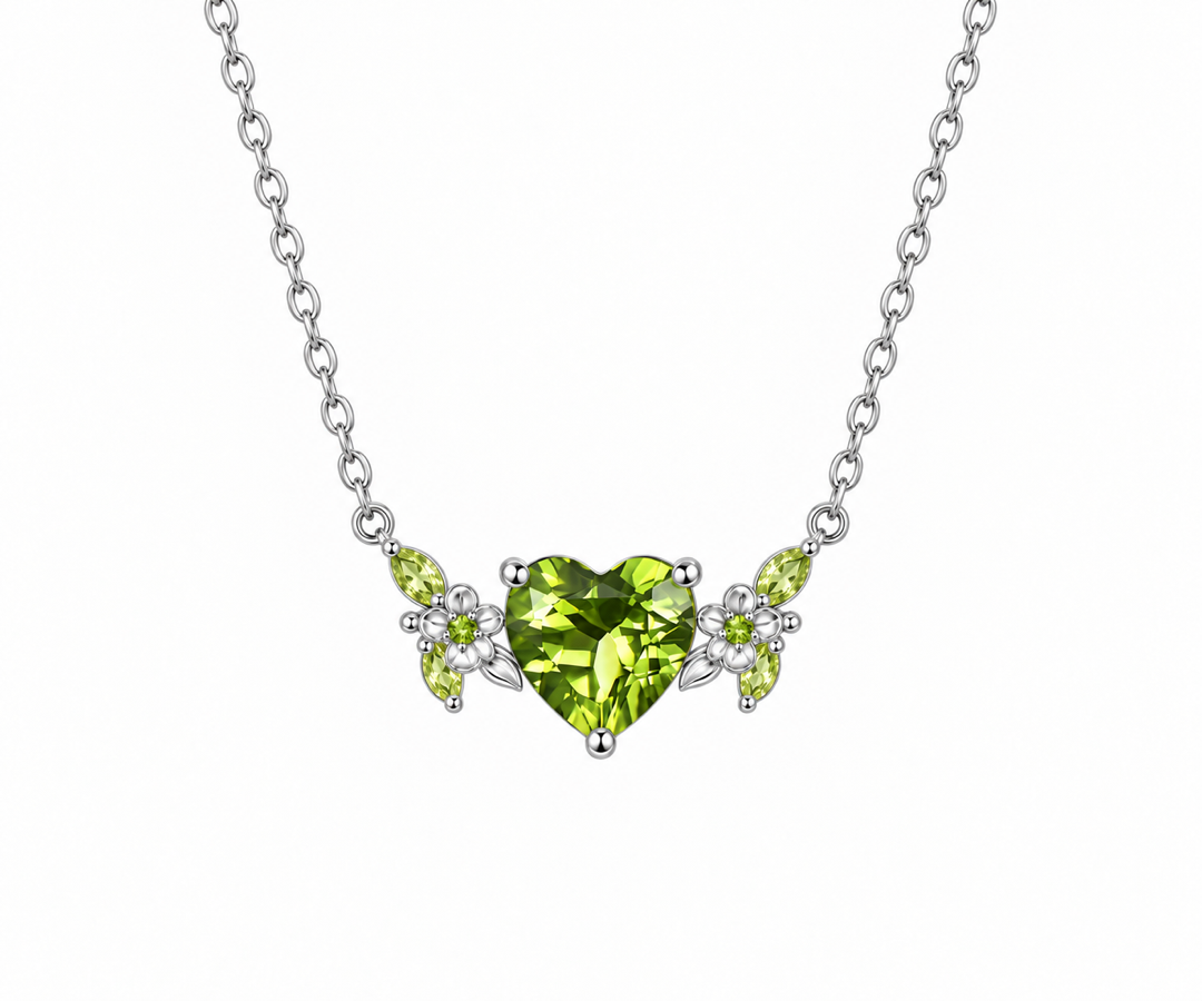 Sterling silver botanical station necklace with a heart-cut green peridot