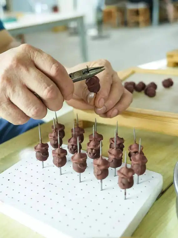 Hand forming aromatic scent beads for WhisperVow jewelry